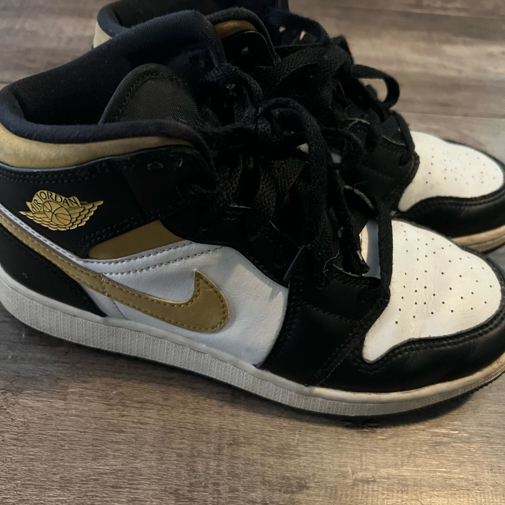 Jordan Kids Black, White, and Gold Sneakers